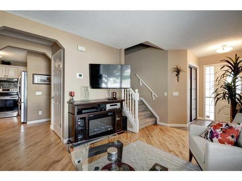 134 Riverwood Crescent Se, Calgary, AB - Indoor Photo Showing Living Room With Fireplace