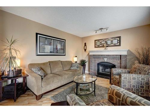 134 Riverwood Crescent Se, Calgary, AB - Indoor Photo Showing Living Room With Fireplace