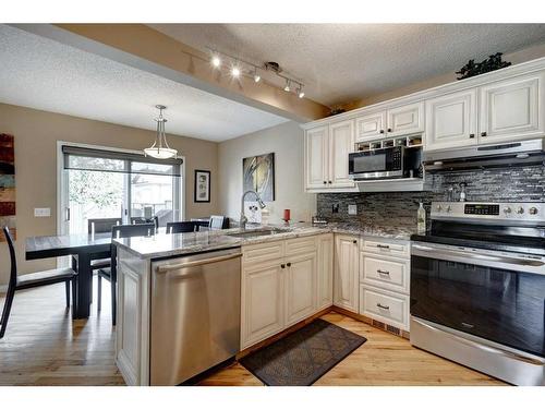 134 Riverwood Crescent Se, Calgary, AB - Indoor Photo Showing Kitchen With Stainless Steel Kitchen