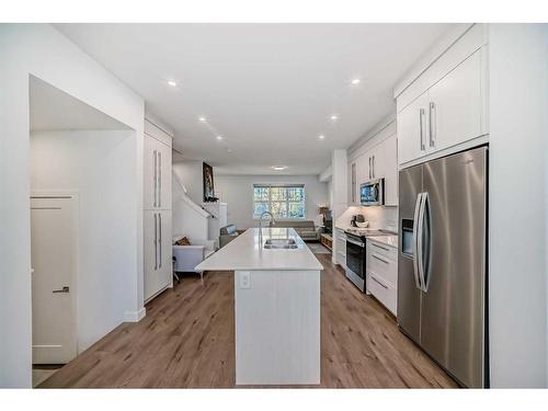 238 Dawson Way, Chestermere, AB - Indoor Photo Showing Kitchen With Double Sink