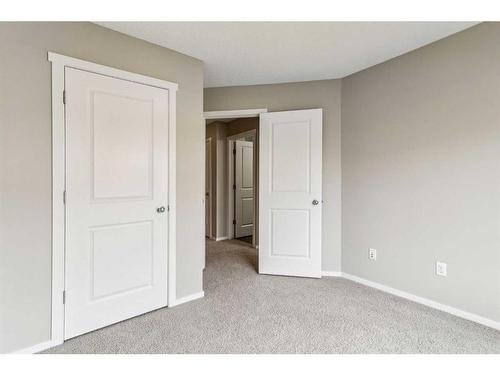 1111-125 Panatella Way Nw, Calgary, AB - Indoor Photo Showing Other Room