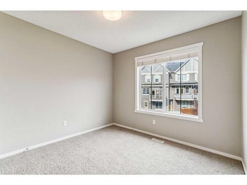 1111-125 Panatella Way Nw, Calgary, AB - Indoor Photo Showing Other Room