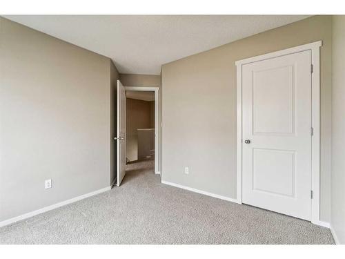 1111-125 Panatella Way Nw, Calgary, AB - Indoor Photo Showing Other Room