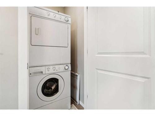 1111-125 Panatella Way Nw, Calgary, AB - Indoor Photo Showing Laundry Room