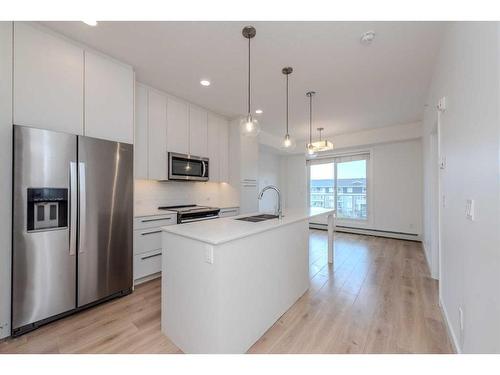 1424-76 Cornerstone Passage Ne, Calgary, AB - Indoor Photo Showing Kitchen With Double Sink With Upgraded Kitchen