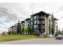 1416-625 Glenbow Drive, Cochrane, AB  - Outdoor With Balcony With Facade 