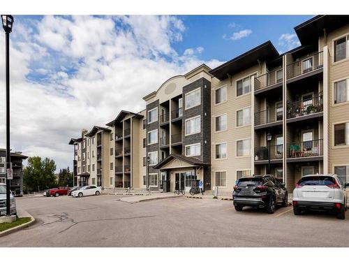 1416-625 Glenbow Drive, Cochrane, AB - Outdoor With Balcony With Facade