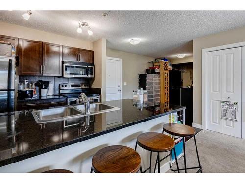 1416-625 Glenbow Drive, Cochrane, AB - Indoor Photo Showing Kitchen With Double Sink