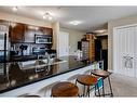 1416-625 Glenbow Drive, Cochrane, AB  - Indoor Photo Showing Kitchen With Double Sink 