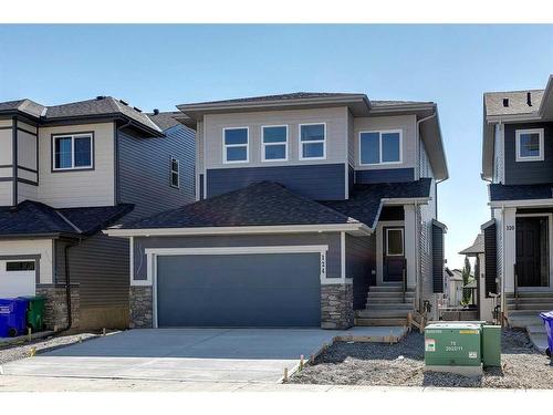 124 Heritage Boulevard, Cochrane, AB - Outdoor With Facade