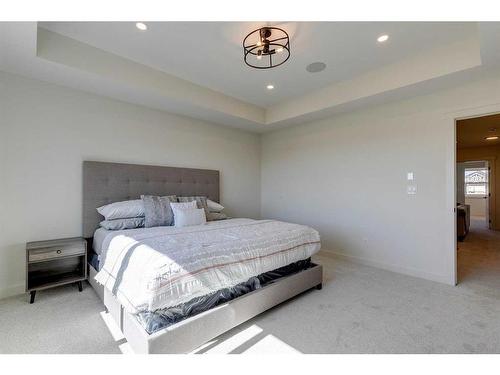 124 Heritage Boulevard, Cochrane, AB - Indoor Photo Showing Bedroom