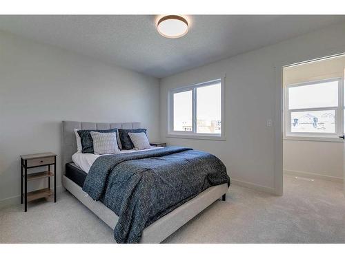 124 Heritage Boulevard, Cochrane, AB - Indoor Photo Showing Bedroom