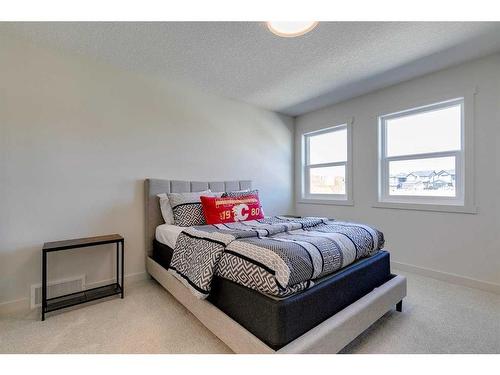 124 Heritage Boulevard, Cochrane, AB - Indoor Photo Showing Bedroom