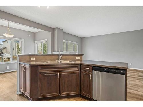 16 Drake Landing Mews, Okotoks, AB - Indoor Photo Showing Kitchen With Double Sink