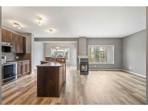 16 Drake Landing Mews, Okotoks, AB - Indoor With Fireplace