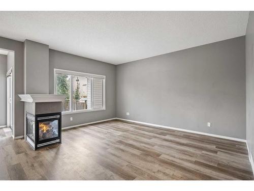 16 Drake Landing Mews, Okotoks, AB - Indoor With Fireplace