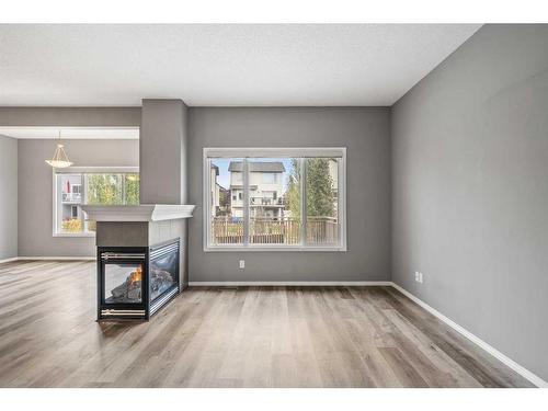 16 Drake Landing Mews, Okotoks, AB - Indoor Photo Showing Living Room With Fireplace