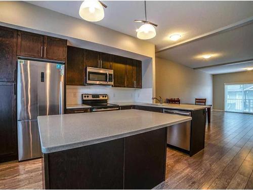 1407-280 Williamstown Close Nw, Airdrie, AB - Indoor Photo Showing Kitchen With Stainless Steel Kitchen