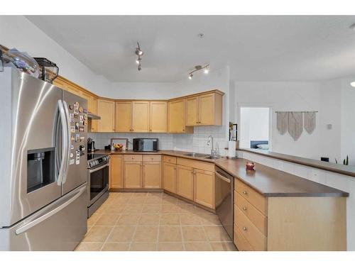 303-2416 Erlton Street Sw, Calgary, AB - Indoor Photo Showing Kitchen With Stainless Steel Kitchen With Double Sink