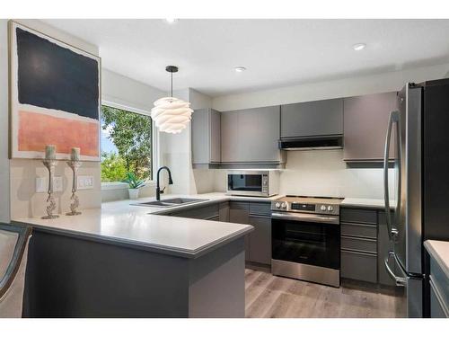 104 Christie Knoll Heights Sw, Calgary, AB - Indoor Photo Showing Kitchen With Stainless Steel Kitchen With Double Sink