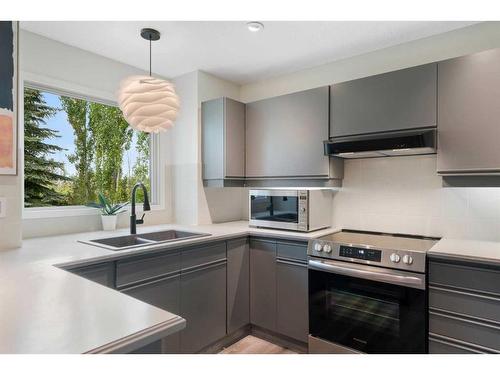 104 Christie Knoll Heights Sw, Calgary, AB - Indoor Photo Showing Kitchen With Double Sink