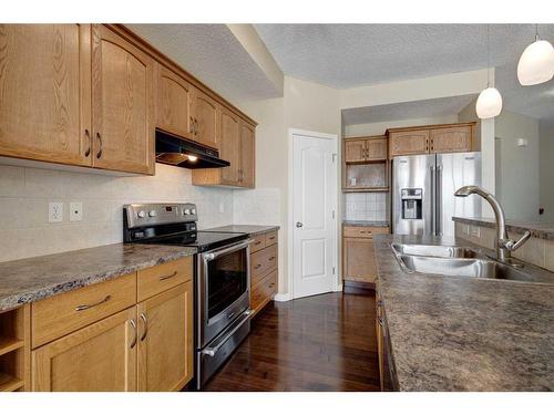 1047 Copperfield Boulevard Se, Calgary, AB - Indoor Photo Showing Kitchen With Stainless Steel Kitchen With Double Sink