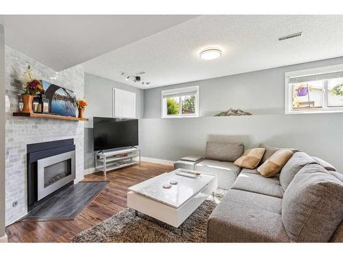 75 Woodglen Road Sw, Calgary, AB - Indoor Photo Showing Living Room With Fireplace