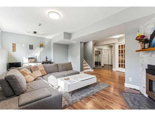 75 Woodglen Road Sw, Calgary, AB - Indoor Photo Showing Living Room With Fireplace