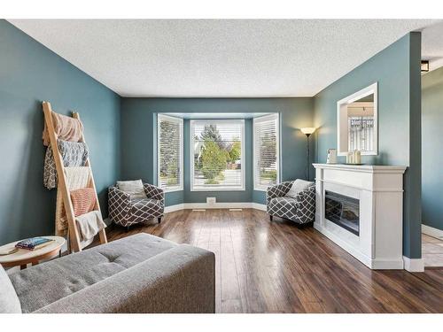 75 Woodglen Road Sw, Calgary, AB - Indoor Photo Showing Living Room With Fireplace