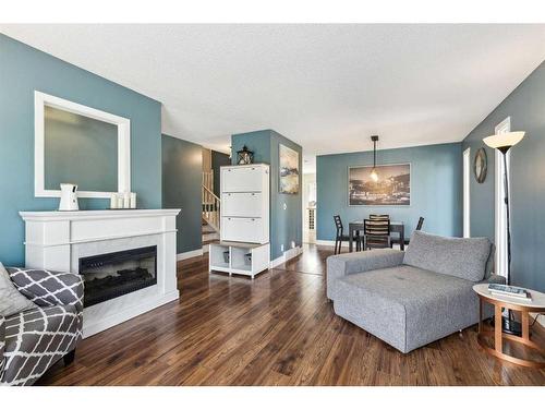 75 Woodglen Road Sw, Calgary, AB - Indoor Photo Showing Living Room With Fireplace