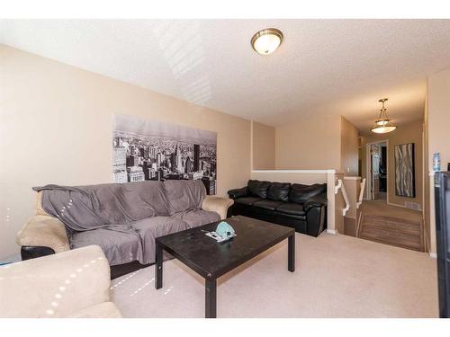 154 Bridlewood Court Sw, Calgary, AB - Indoor Photo Showing Living Room