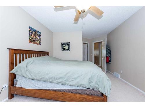 154 Bridlewood Court Sw, Calgary, AB - Indoor Photo Showing Bedroom