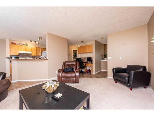 154 Bridlewood Court Sw, Calgary, AB - Indoor Photo Showing Living Room