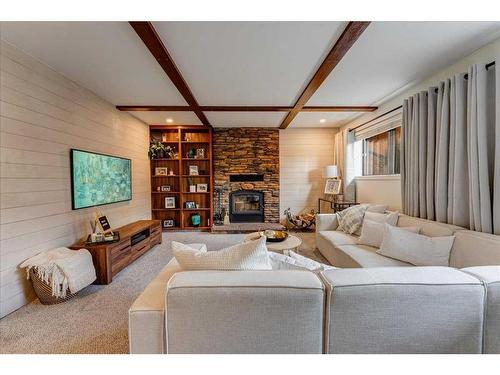 6820 Coach Ridge Road Sw, Calgary, AB - Indoor Photo Showing Living Room With Fireplace