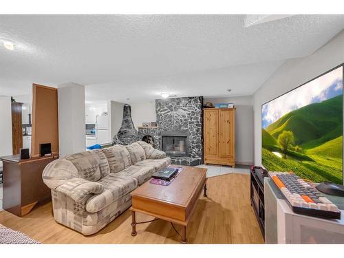 71 Martindale Close Ne, Calgary, AB - Indoor Photo Showing Living Room With Fireplace