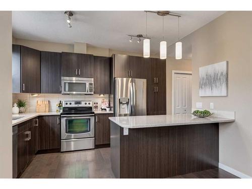 604-10 Auburn Bay Avenue Se, Calgary, AB - Indoor Photo Showing Kitchen With Stainless Steel Kitchen With Upgraded Kitchen