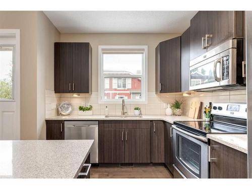 604-10 Auburn Bay Avenue Se, Calgary, AB - Indoor Photo Showing Kitchen With Stainless Steel Kitchen With Upgraded Kitchen