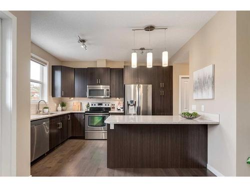 604-10 Auburn Bay Avenue Se, Calgary, AB - Indoor Photo Showing Kitchen With Stainless Steel Kitchen With Upgraded Kitchen