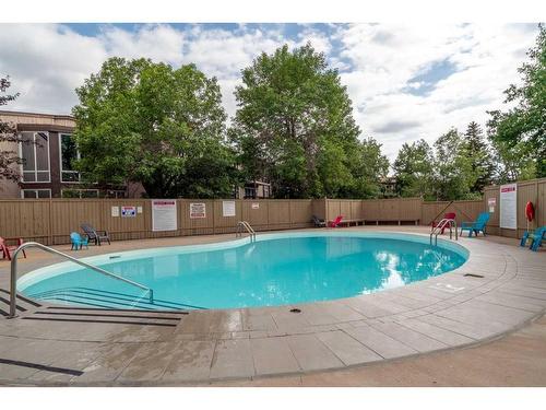 236-820 89 Avenue Sw, Calgary, AB - Outdoor With In Ground Pool With Backyard