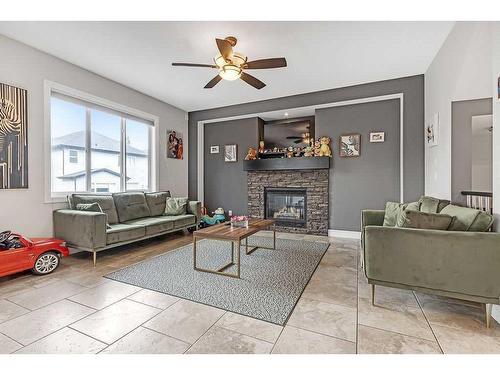 58 Cranberry Mews Se, Calgary, AB - Indoor Photo Showing Living Room With Fireplace