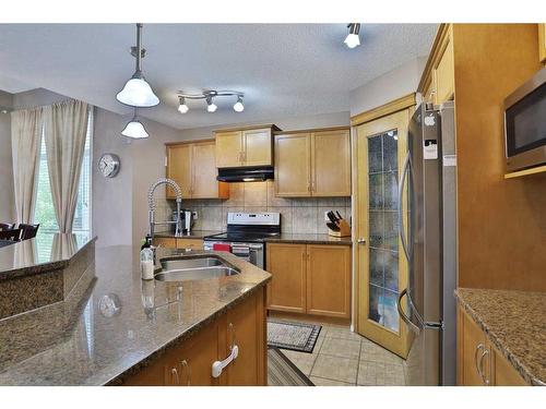 96 Tuscany Ravine Crescent Nw, Calgary, AB - Indoor Photo Showing Kitchen With Double Sink