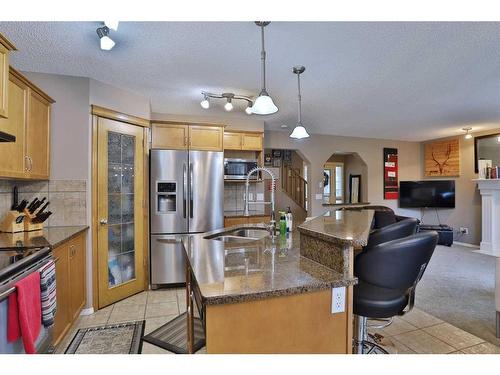 96 Tuscany Ravine Crescent Nw, Calgary, AB - Indoor Photo Showing Kitchen With Stainless Steel Kitchen With Double Sink