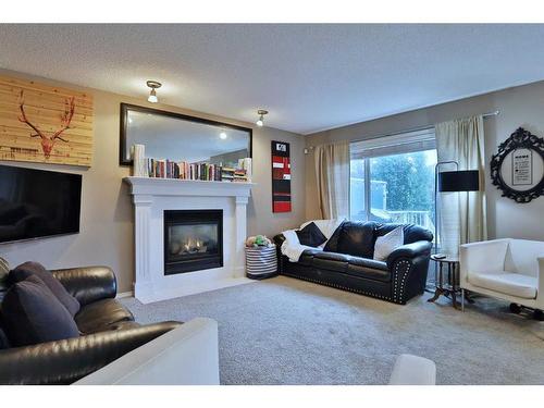 96 Tuscany Ravine Crescent Nw, Calgary, AB - Indoor Photo Showing Living Room With Fireplace