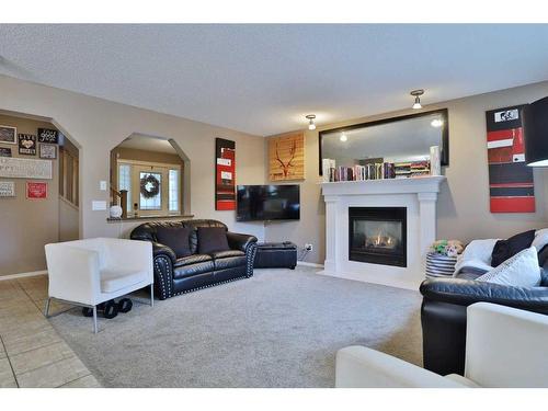 96 Tuscany Ravine Crescent Nw, Calgary, AB - Indoor Photo Showing Living Room With Fireplace