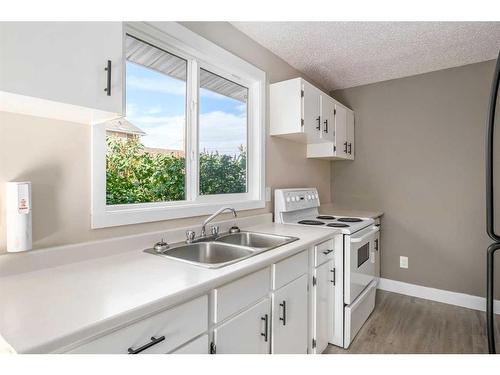 7228 & 7230 Ogden Road Se, Calgary, AB - Indoor Photo Showing Kitchen With Double Sink