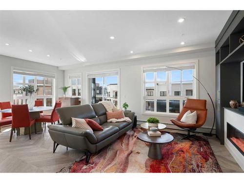 401-4275 Norford Avenue Nw, Calgary, AB - Indoor Photo Showing Living Room With Fireplace