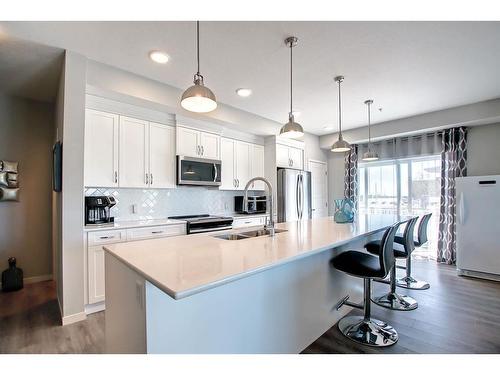 130-20 Seton Park Se, Calgary, AB - Indoor Photo Showing Kitchen With Stainless Steel Kitchen With Double Sink With Upgraded Kitchen