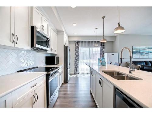 130-20 Seton Park Se, Calgary, AB - Indoor Photo Showing Kitchen With Stainless Steel Kitchen With Double Sink With Upgraded Kitchen