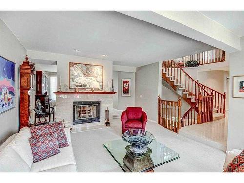 32 Patterson Crescent Sw, Calgary, AB - Indoor Photo Showing Living Room With Fireplace