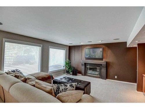 32 Patterson Crescent Sw, Calgary, AB - Indoor Photo Showing Living Room With Fireplace